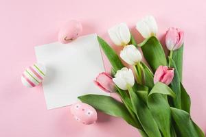 Easter Greeting card. White empty blank for text, easter eggs and white pink tulips. Mockup concept. photo