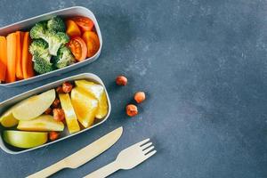 Lunch box with vegetables and fruits. Delicious balanced food concept. Top view, copy space photo