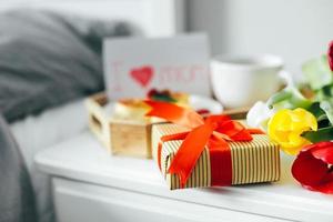 Close-up of gift present box for Mother's day. Festive brunch or breakfast. Good morning concept photo