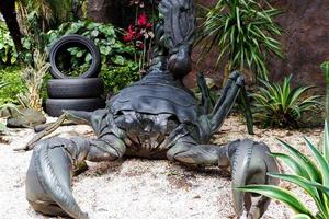 Old tires that are recycled into the shape of scorpions. photo