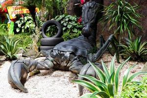 Old tires that are recycled into the shape of scorpions. photo