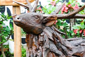 Selective focus of deer made of wood carvings. photo