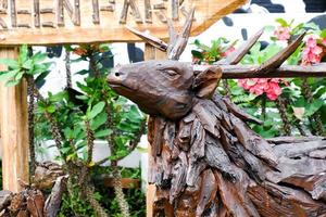 Selective focus of deer made of wood carvings. photo