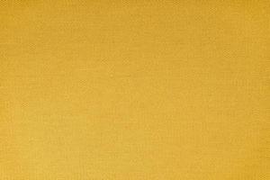 Texture of yellow fabric diagonal weave pattern. Decorative textile background photo
