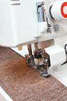 Overlock sewing machine in process. Professional equipment photo