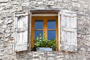 House facade with white shutters in France photo