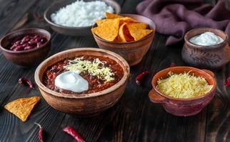 Bowl of chili con carne with the ingredients photo