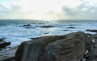 Sea waves crushing on the rocks 2 photo