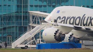 NOVOSIBIRSK, RUSSIAN FEDERATION JUNE 10, 2020 - Cargo Boeing 747 of Cargolux prepares for departure at Tolmachevo Airport, Novosibirsk OVB. The crew is boarding the plane video