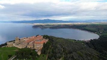 Aerial view of the Etruscan city of Populonia and the gulf of Baratti Tuscany Italy video