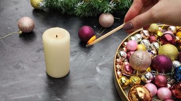 woman lighting advent candle for christmas video