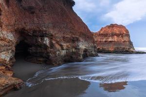 Beautiful morning view of Indonesia. beach with soft coral waves and white sand photo