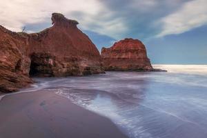 Beautiful morning view of Indonesia. beach with soft coral waves and white sand photo