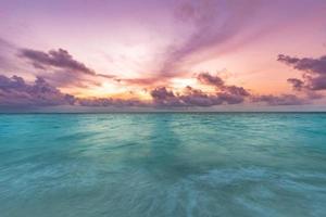 Beautiful nature view, sea - ocean water with dramatic sky and colors. Beautiful background of seascape and horizon, sun rays, beams. Calmness and inspiration concept, motivational nature scenery photo