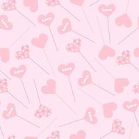 Seamless pattern with heart-shaped toppers with different patterns randomly scattered on a pink background in vector