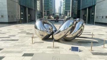 Dubai, UAE, 2022 - The Gate artwork in Dubai Financial center district DIFC,United Arab Emirates unique modern buildings video