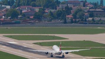 SOCHI, RUSSIA JULY 28, 2022 - Airbus A330 of Nordwind takeoff and climb over the Black Sea at Sochi airport, rear view. Long shot of a passenger plane flying away video