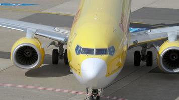 DUSSELDORF, GERMANY JULY 23, 2017 - Boeing 737 800 of TUI airlines taxis to the airport terminal Dusseldorf. Passenger Airliner of TUI airlines taxiing at the airport video