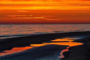 Patterns in the Sea Sand at Sunset photo