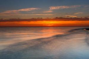 Patterns in the Sea Sand at Sunset photo