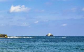 Mazunte Mexico Beautiful paradise beach with mountains cliffs rocks waves. photo