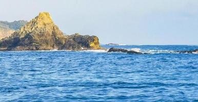 Mazunte Mexico Beautiful paradise beach with mountains cliffs rocks waves. photo