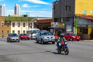 Merced San Jose Costa Rica 2021 Colorful street cars stores buildings people San Jose Costa Rica. photo