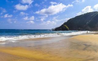 Mazunte Mexico Beautiful paradise beach with mountains cliffs rocks waves. photo