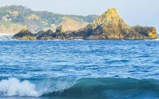 Mazunte Mexico Beautiful paradise beach with mountains cliffs rocks waves. photo