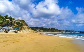 Mazunte Mexico Beautiful paradise beach with mountains cliffs rocks waves. photo