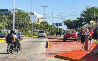 Puerto Escondido Oaxaca Mexico 2022 Colorful streets cars high traffic stores people buildings trade Mexico. photo