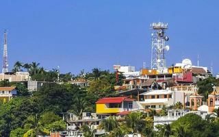 Hotels buildings houses in tropical paradise in Puerto Escondido Mexico. photo