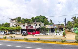 Puerto Escondido Oaxaca Mexico 2022 Colorful streets cars high traffic stores people buildings trade Mexico. photo