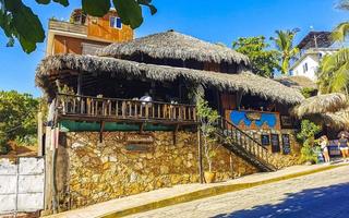 Puerto Escondido Oaxaca Mexico 2022 Hotels buildings houses in tropical paradise in Puerto Escondido Mexico. photo