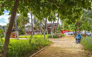 Puerto Escondido Oaxaca Mexico 2022 Colorful streets cars high traffic stores people buildings trade Mexico. photo