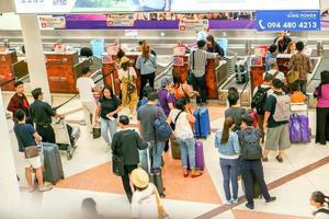 Chiang Mai City, THAILAND, 2019 -  Many Chinese tourists waiting for check-in front of airline counter in the airport to return to the country. After traveling to Thailand photo