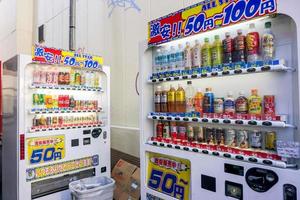 Osaka, Japan,2019 - Competition in the business of selling drinks from vending machine began to rise in Japan. So we often see drinks at a discounted price in a typical alley in the city photo