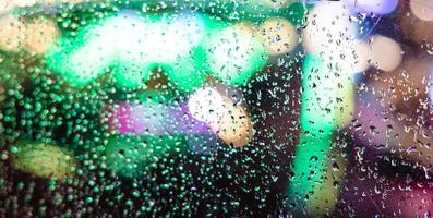 Water droplets on glass window photo