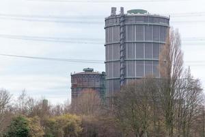 large gasometers in an industrial landscape photo