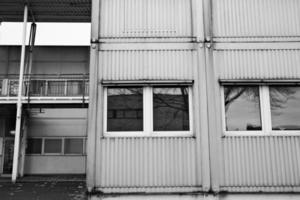 old industrial building facade with windows photo