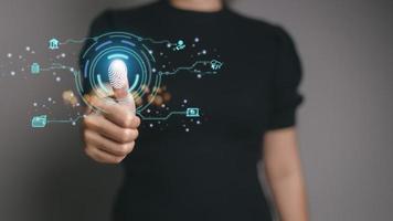 futuristic digital processing of biometric identification fingerprint scanner for access personal financial data. surveillance and security scanning of digital programs cyber futuristic applications photo