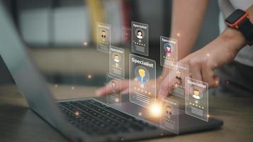 Online recruitment application and one day specialist search service concept with man finger on virtual digital interface with personal cards with rating photo