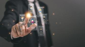 Online recruitment application and one day specialist search service concept with man finger on virtual digital interface with personal cards with rating photo