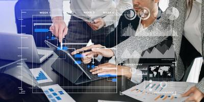 Businessman hand Project manager working and update tasks and Gantt chart scheduling virtual diagram.with smart phone, tablet and laptop photo
