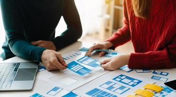UX graphic designer planning application process development prototype wireframe for web smart phone. Creative digital development agency. photo