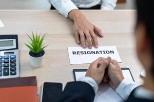 Businessmen send resignation letters to executives or managers. Include information about resignation and vacancies and job changes. photo