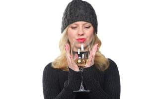 Beautiful model portrait isolated over studio background hold wine glass. photo