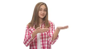 young beautiful woman in gray shirt , holding imaginary object on the palm. isolated on white photo