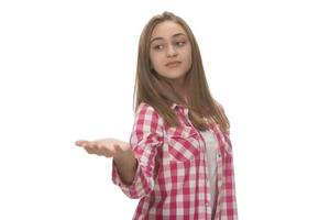 young beautiful woman in gray shirt , holding imaginary object on the palm. isolated on white photo