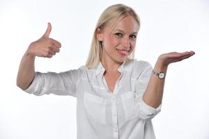 portrait of a beautiful young woman holding imaginary object on a white background photo